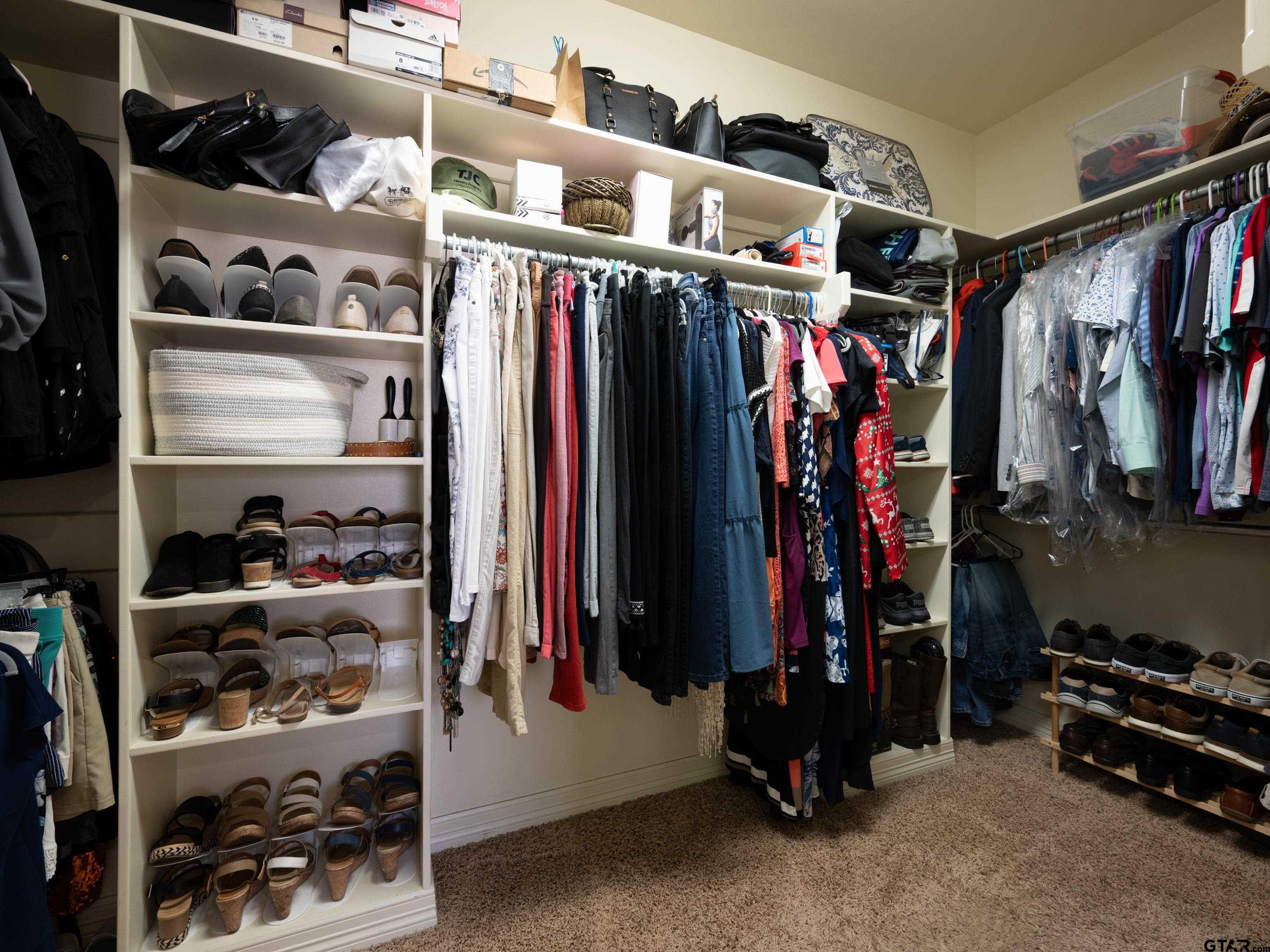 19560 Sandhill Lane Flint, TX 75762 - Photo 20 of 35 a view of walk in closet with clothes and shoes