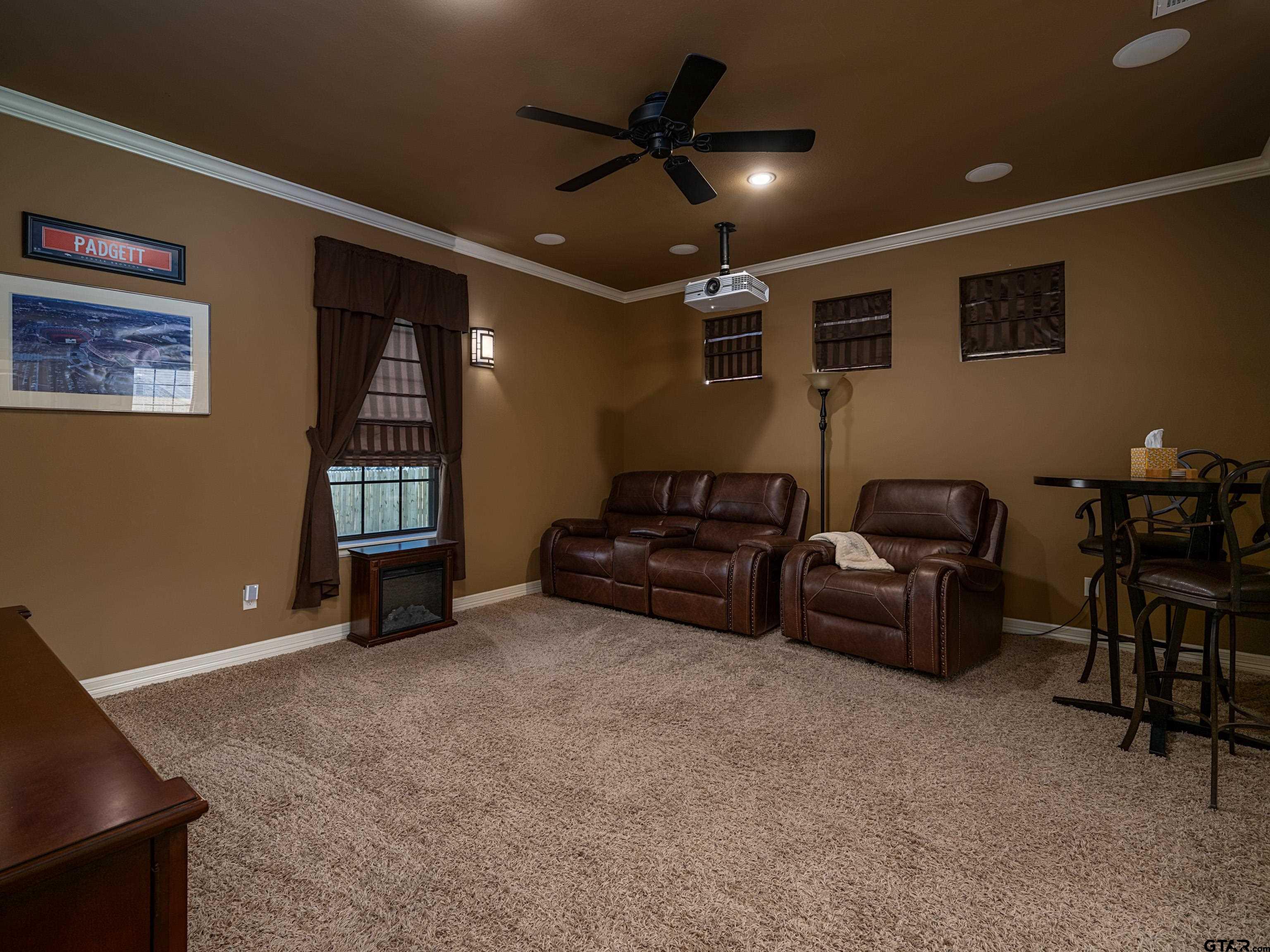 19560 Sandhill Lane Flint, TX 75762 - Photo 21 of 35 a living room with furniture and a ceiling fan