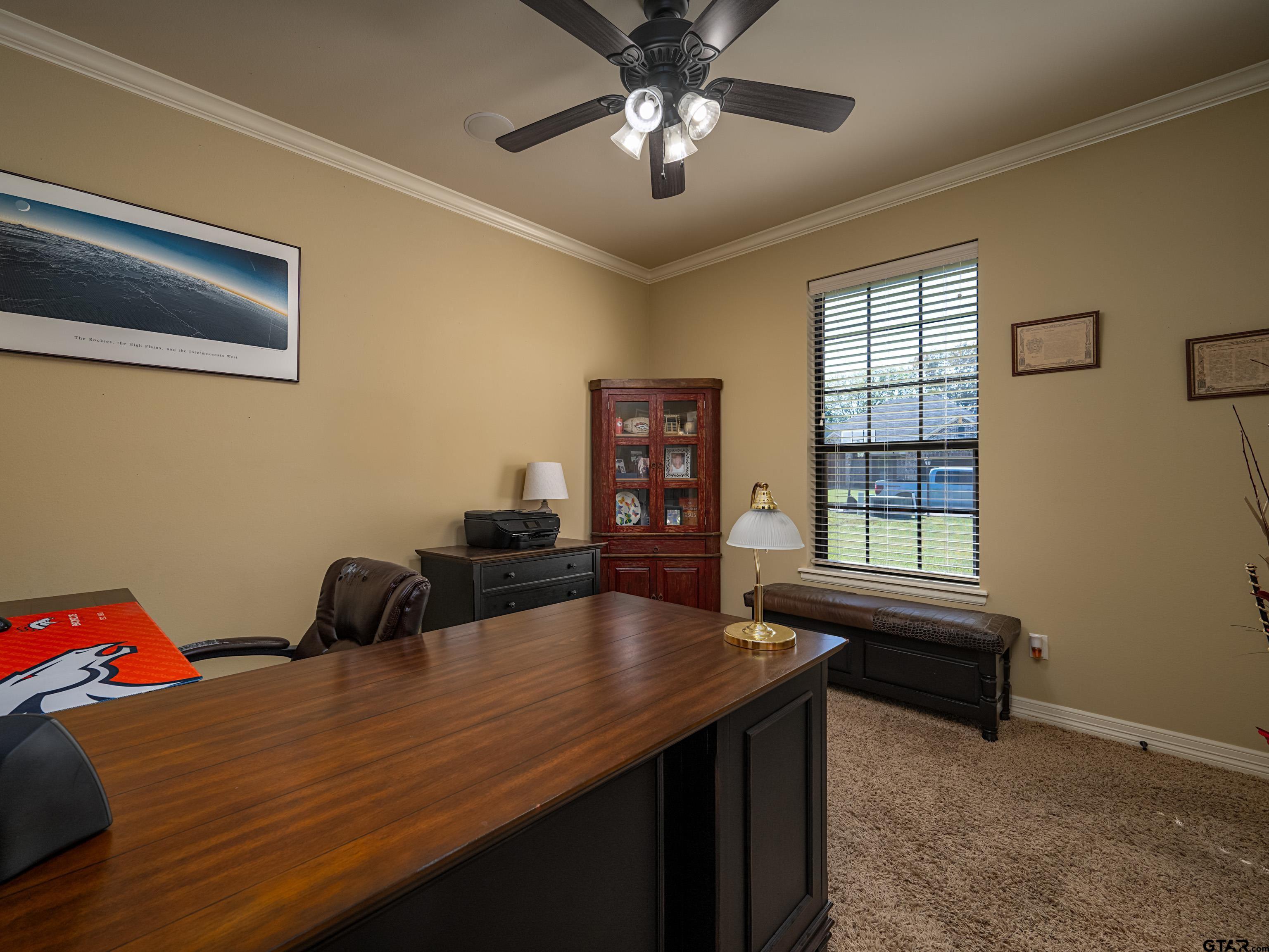19560 Sandhill Lane Flint, TX 75762 - Photo 23 of 35 a bedroom with a bed and a chandelier