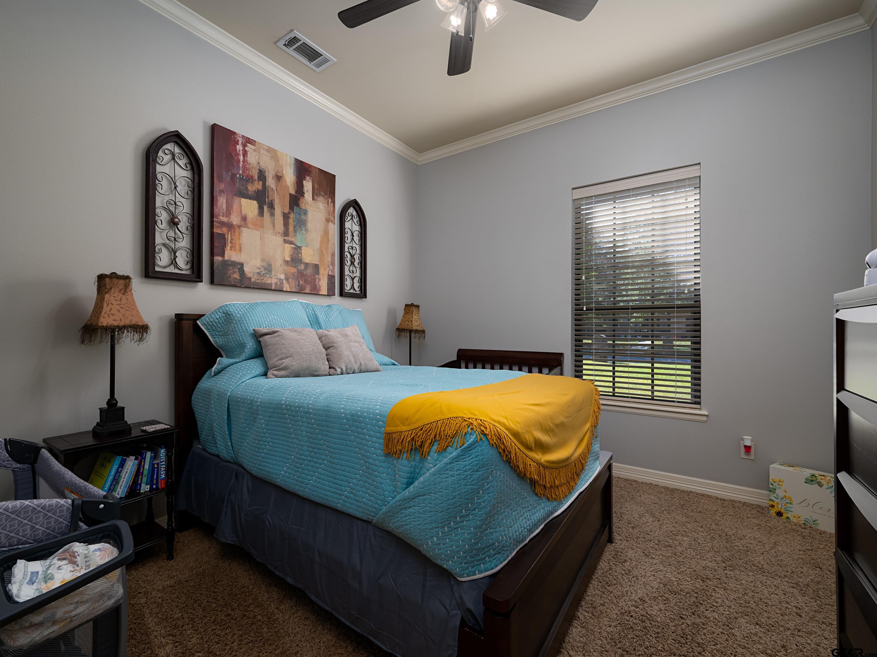 19560 Sandhill Lane Flint, TX 75762 - Photo 26 of 35 a bedroom with a bed and lamp