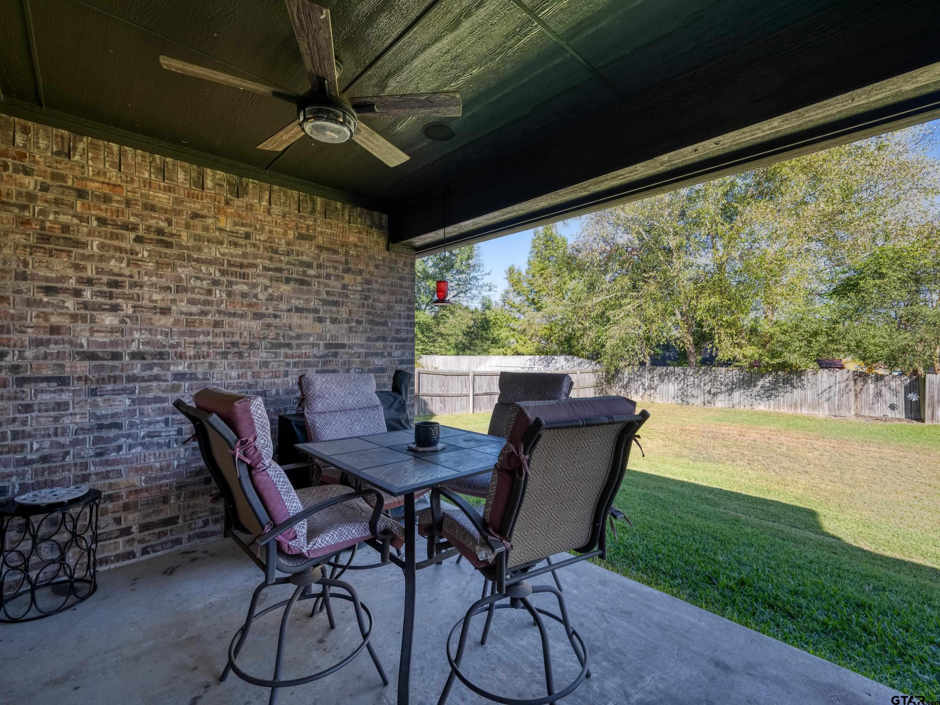19560 Sandhill Lane Flint, TX 75762 - Photo 32 of 35 a table and chairs in the patio