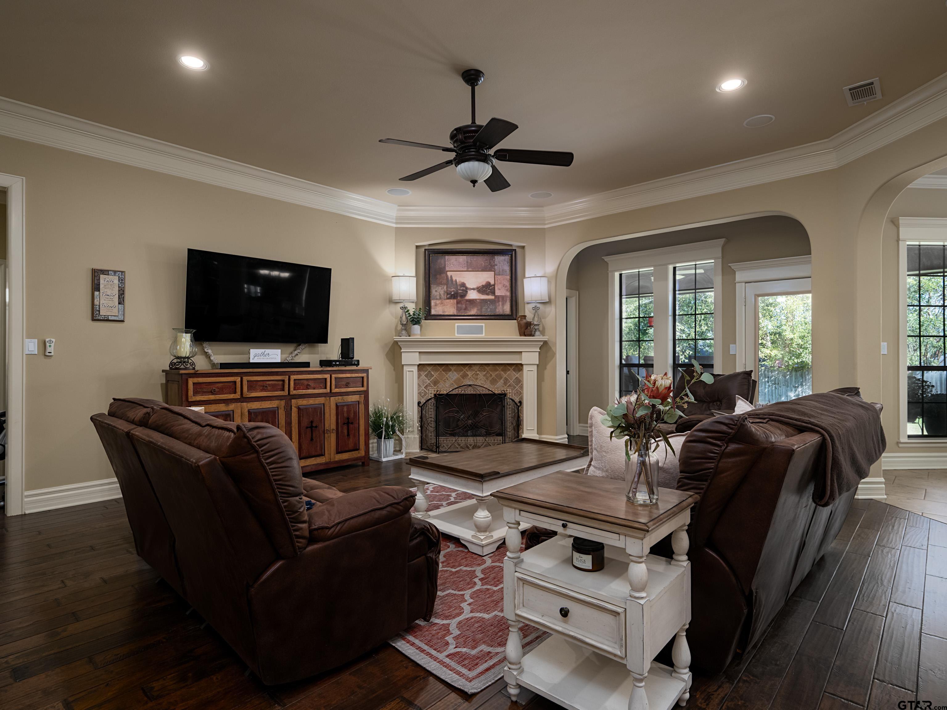 19560 Sandhill Lane Flint, TX 75762 - Photo 8 of 35 a living room with furniture a flat screen tv and a fireplace