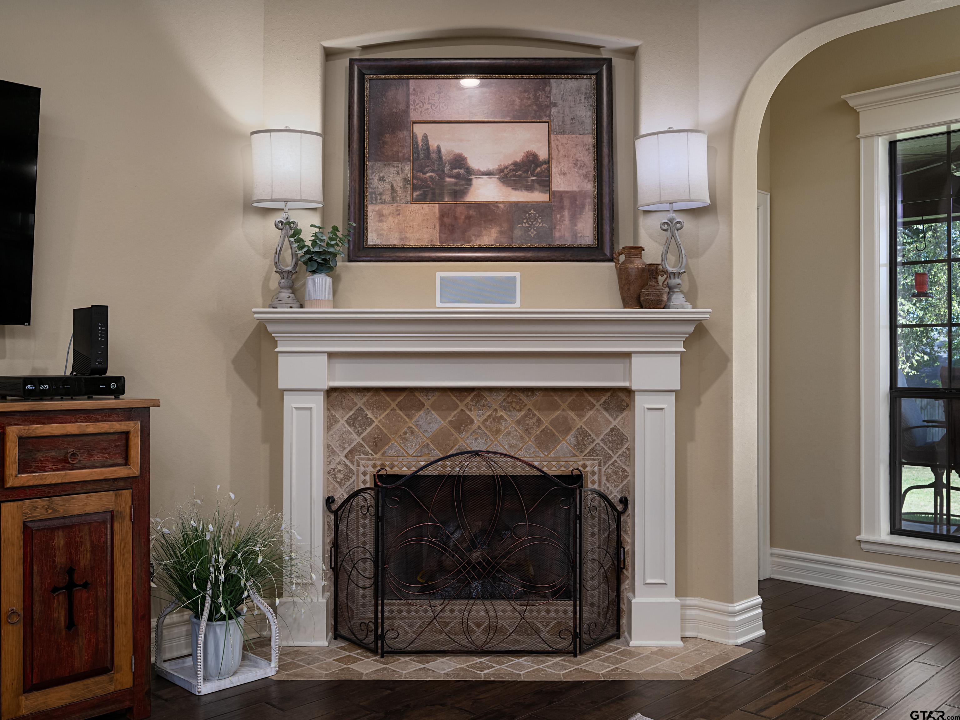 19560 Sandhill Lane Flint, TX 75762 - Photo 9 of 35 a living room with a fireplace and wooden floor