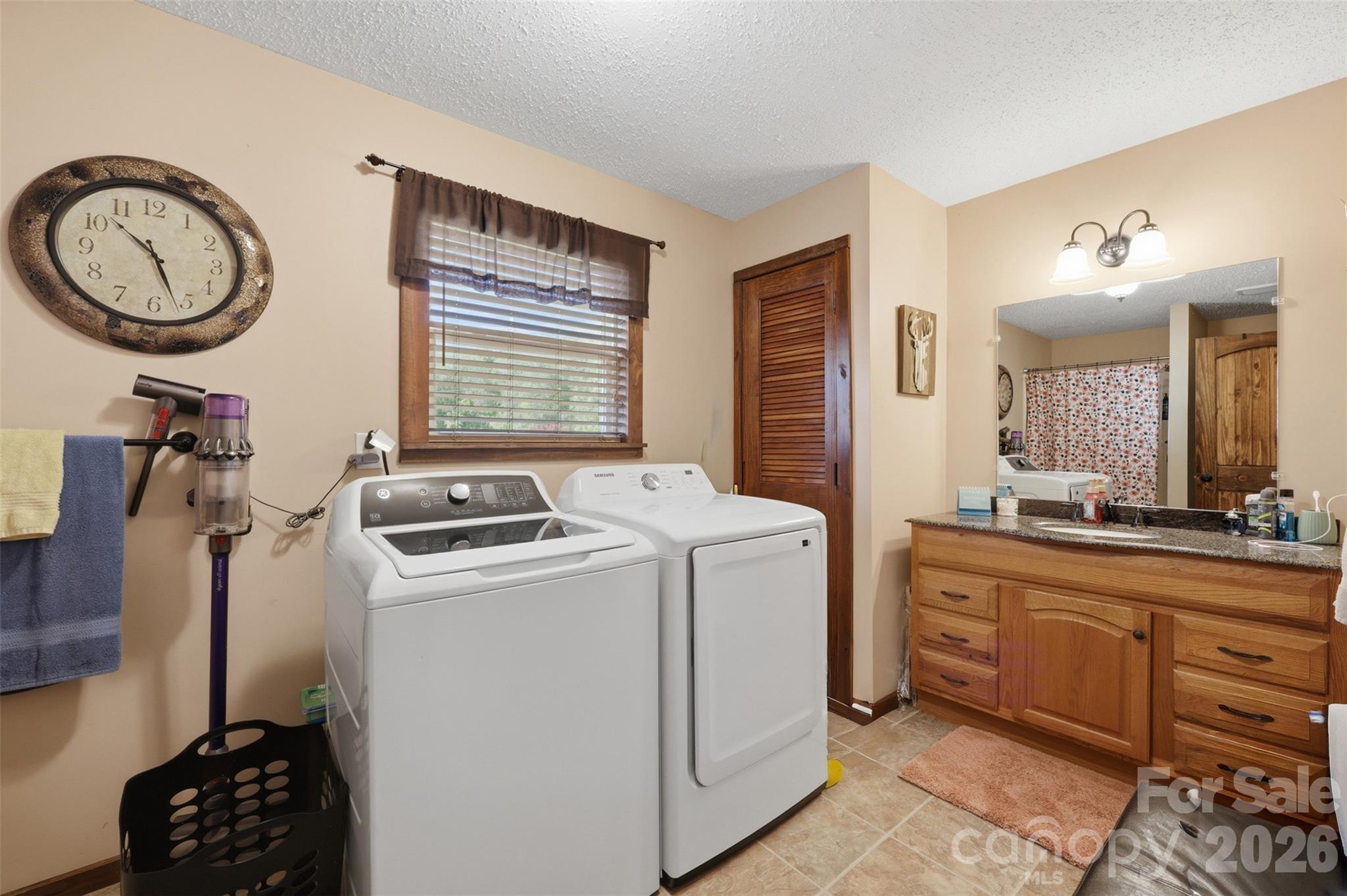 176-174 Oak Hollow Road Union Grove, NC 28689 - Photo 42 of 48 a view of storage and utility room with washer and dryer