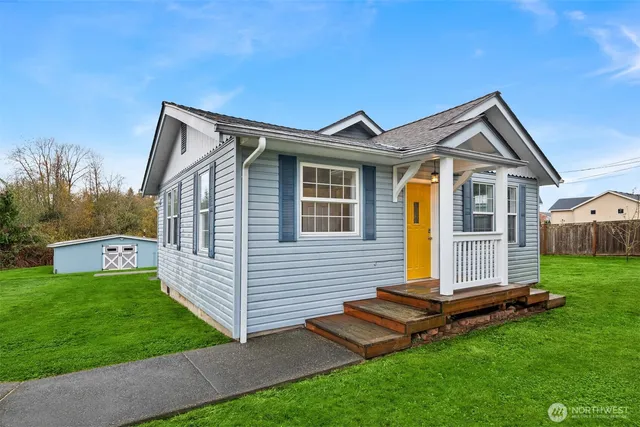 a view of backyard with a garden and deck