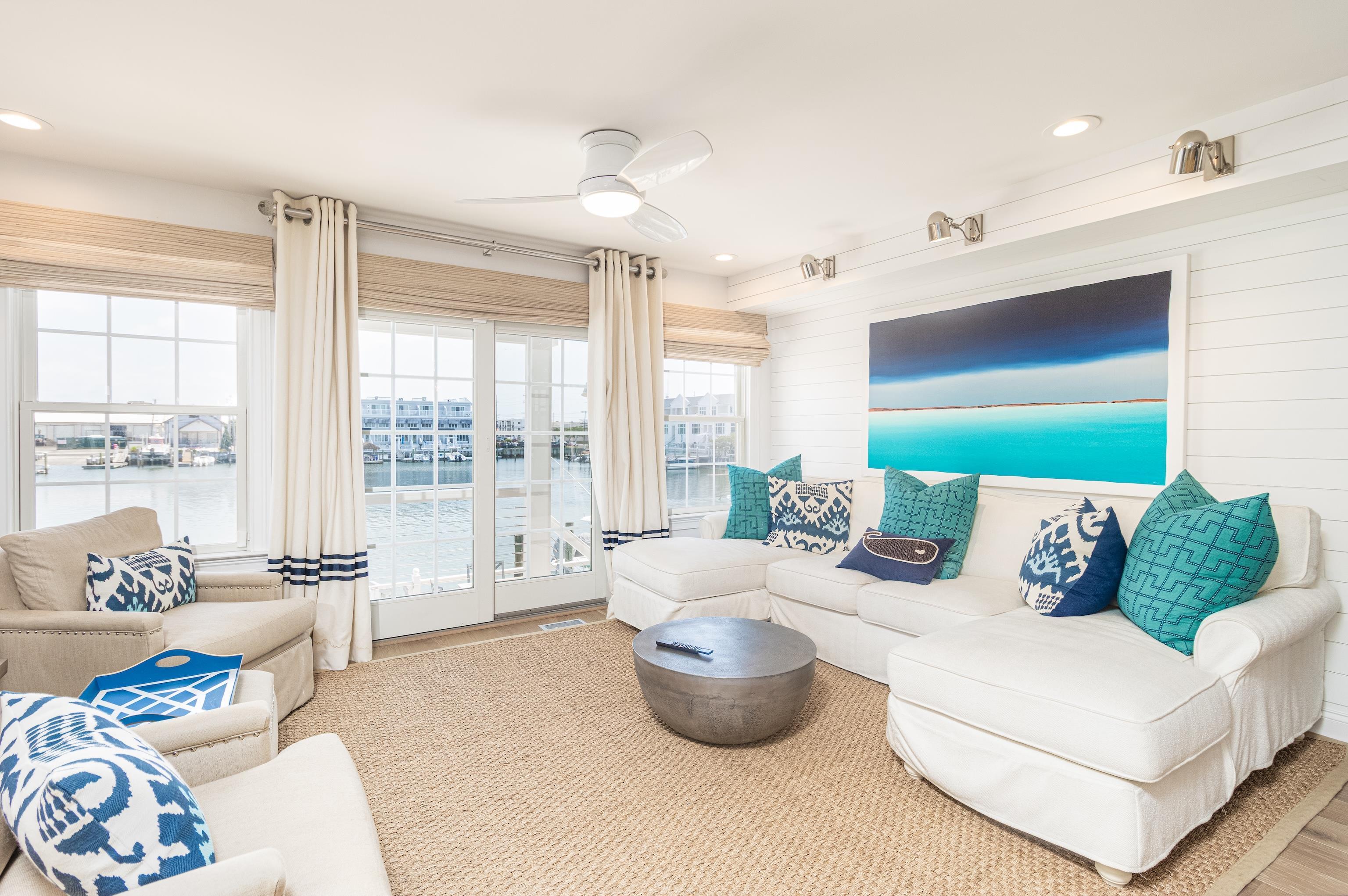 328 83rd Street Stone Harbor, NJ 08247 - Photo 11 of 34 a living room with furniture and a large window