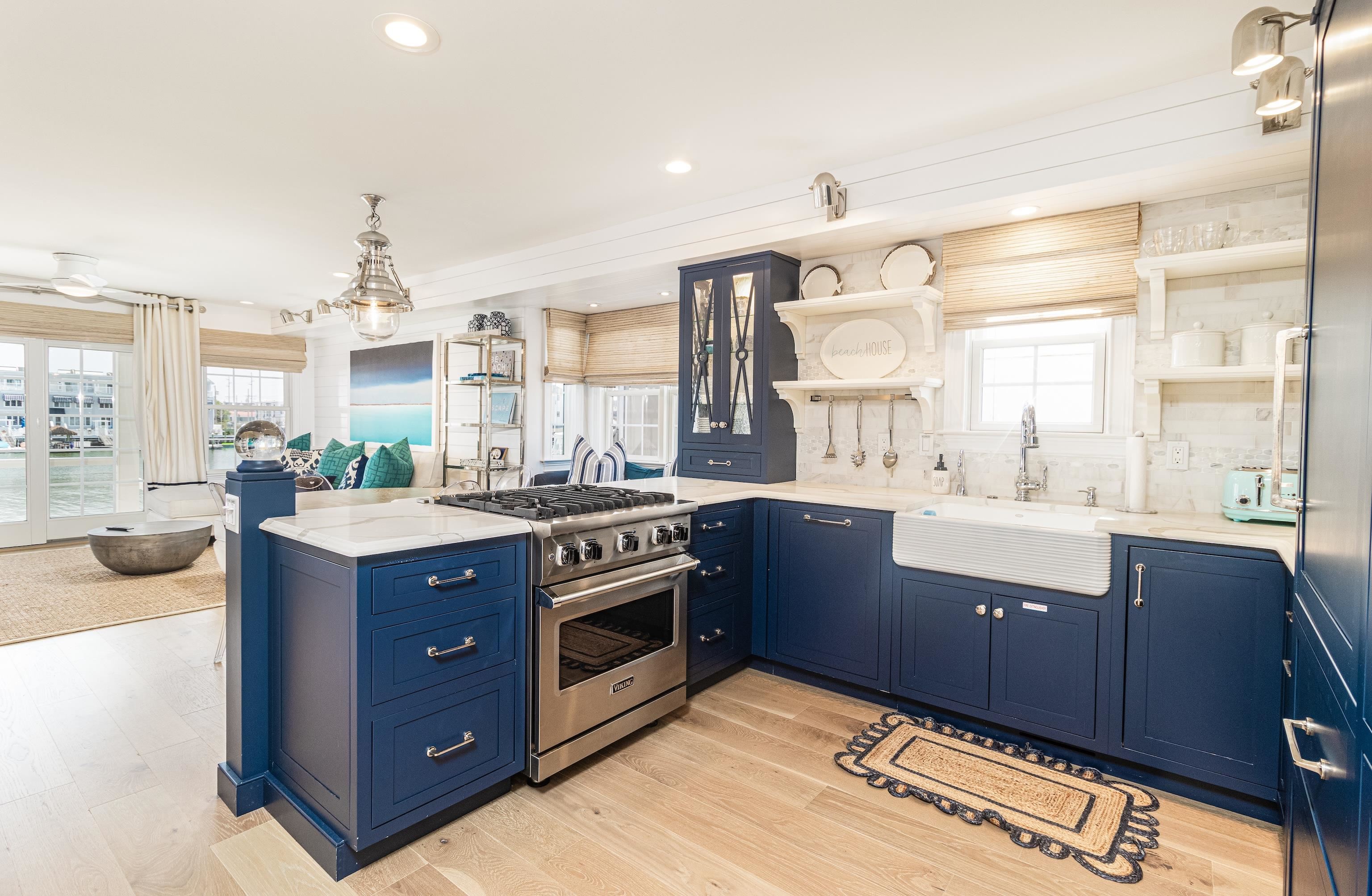 328 83rd Street Stone Harbor, NJ 08247 - Photo 14 of 34 a kitchen with stainless steel appliances granite countertop a stove and a sink