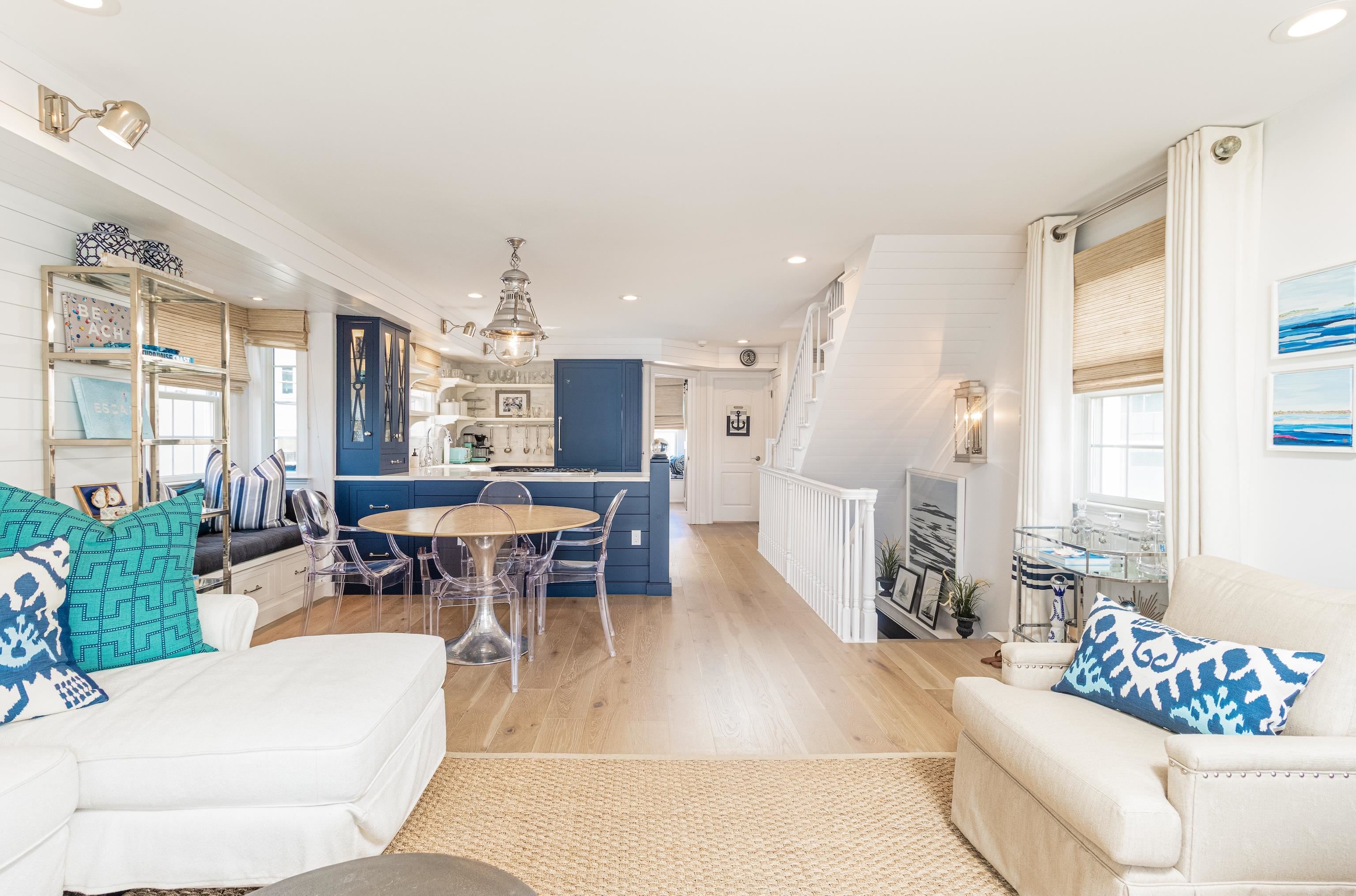 328 83rd Street Stone Harbor, NJ 08247 - Photo 15 of 34 a living room with furniture and a dining table with large windows