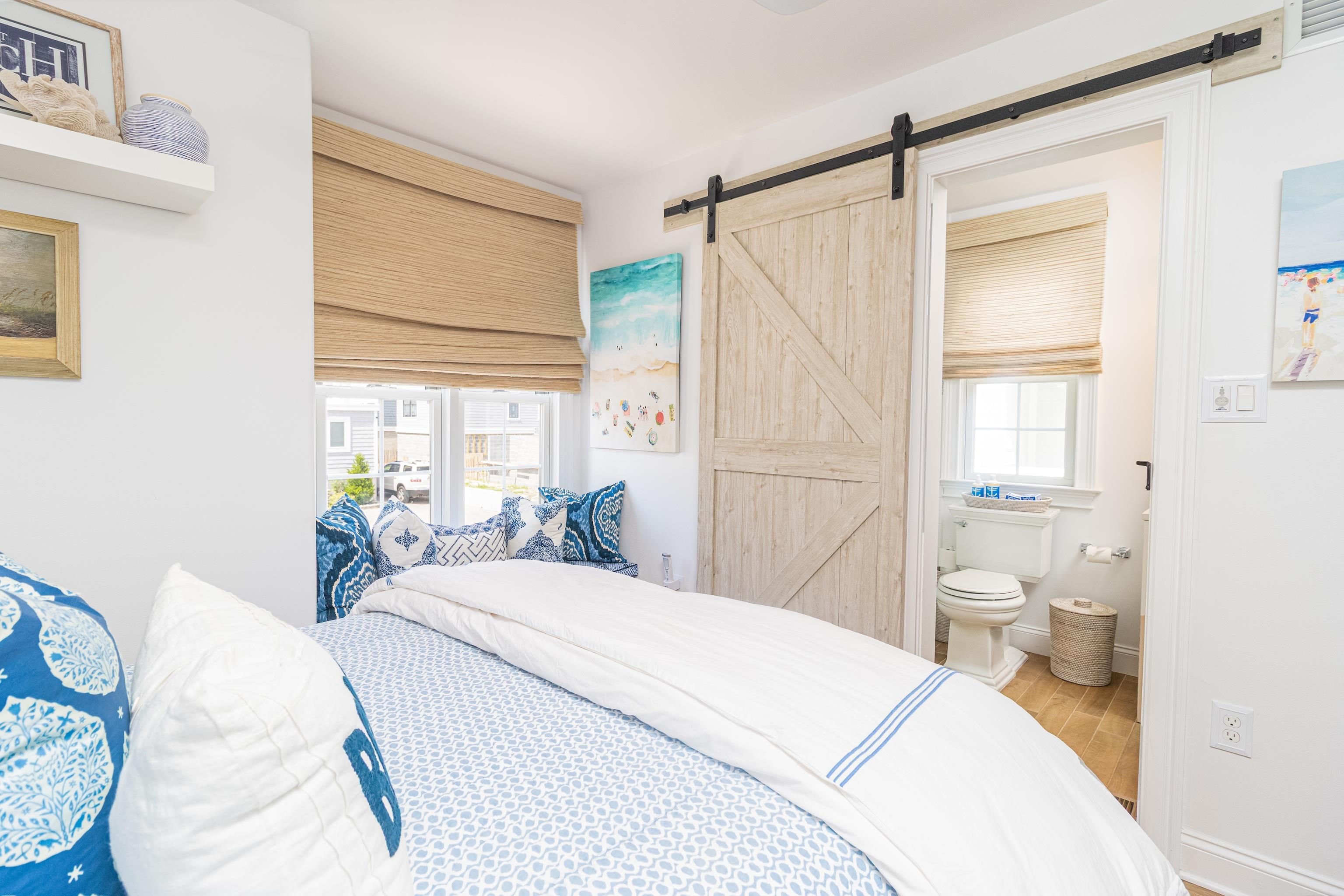 328 83rd Street Stone Harbor, NJ 08247 - Photo 17 of 34 a bedroom with a bed and a large window