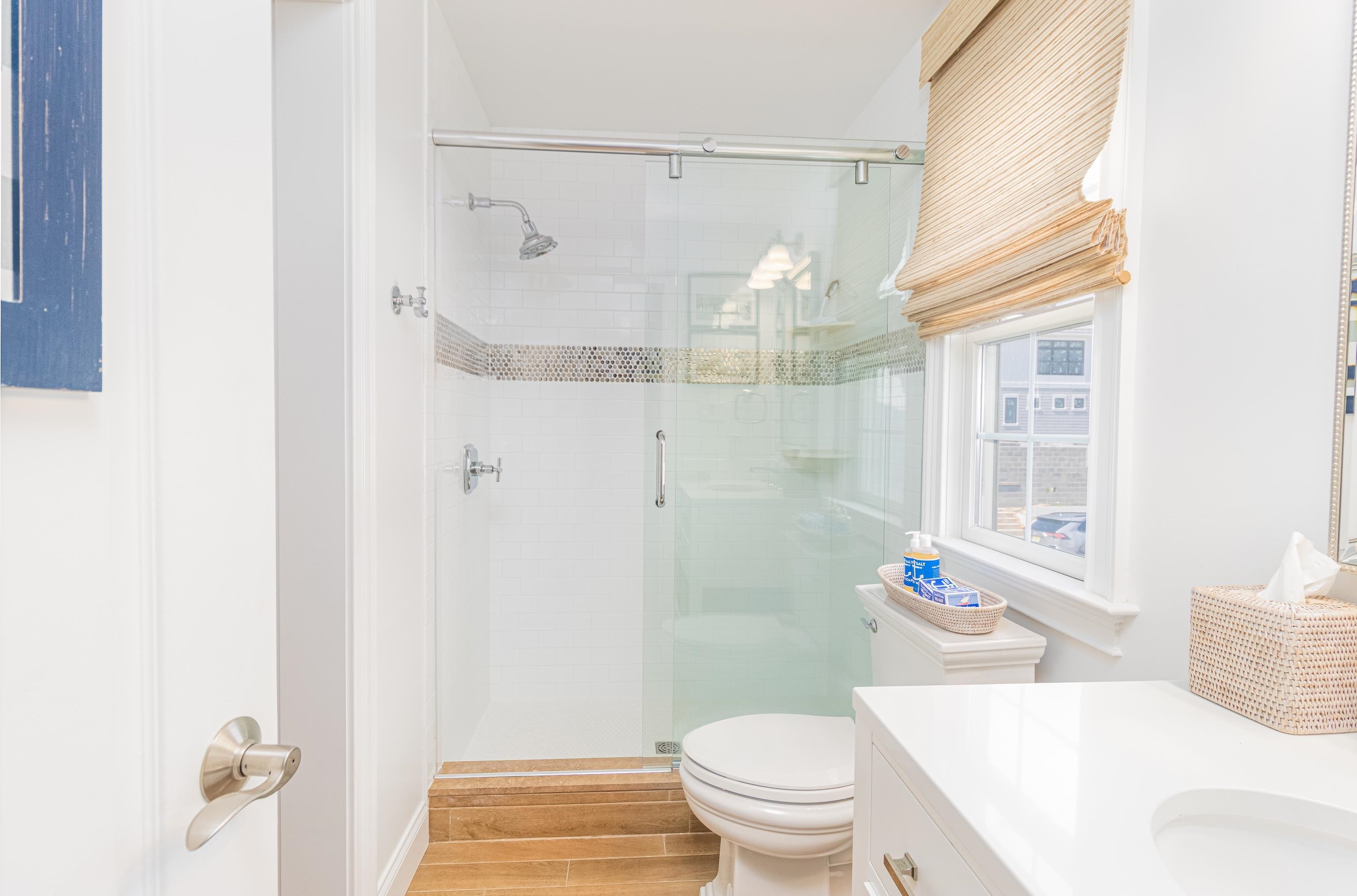 328 83rd Street Stone Harbor, NJ 08247 - Photo 18 of 34 a bathroom with a sink toilet and shower