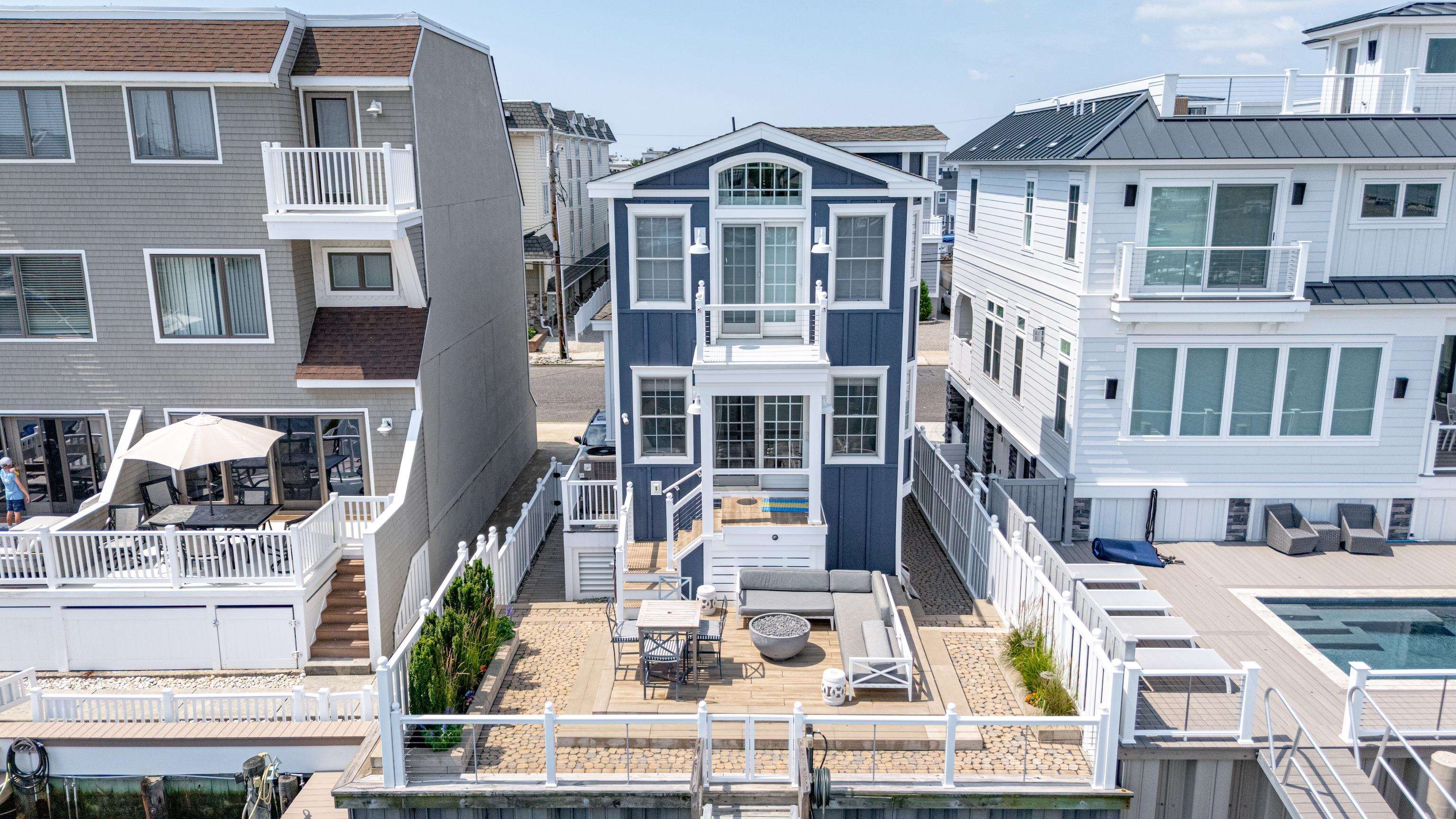 328 83rd Street Stone Harbor, NJ 08247 - Photo 2 of 34 a view of a building with many windows