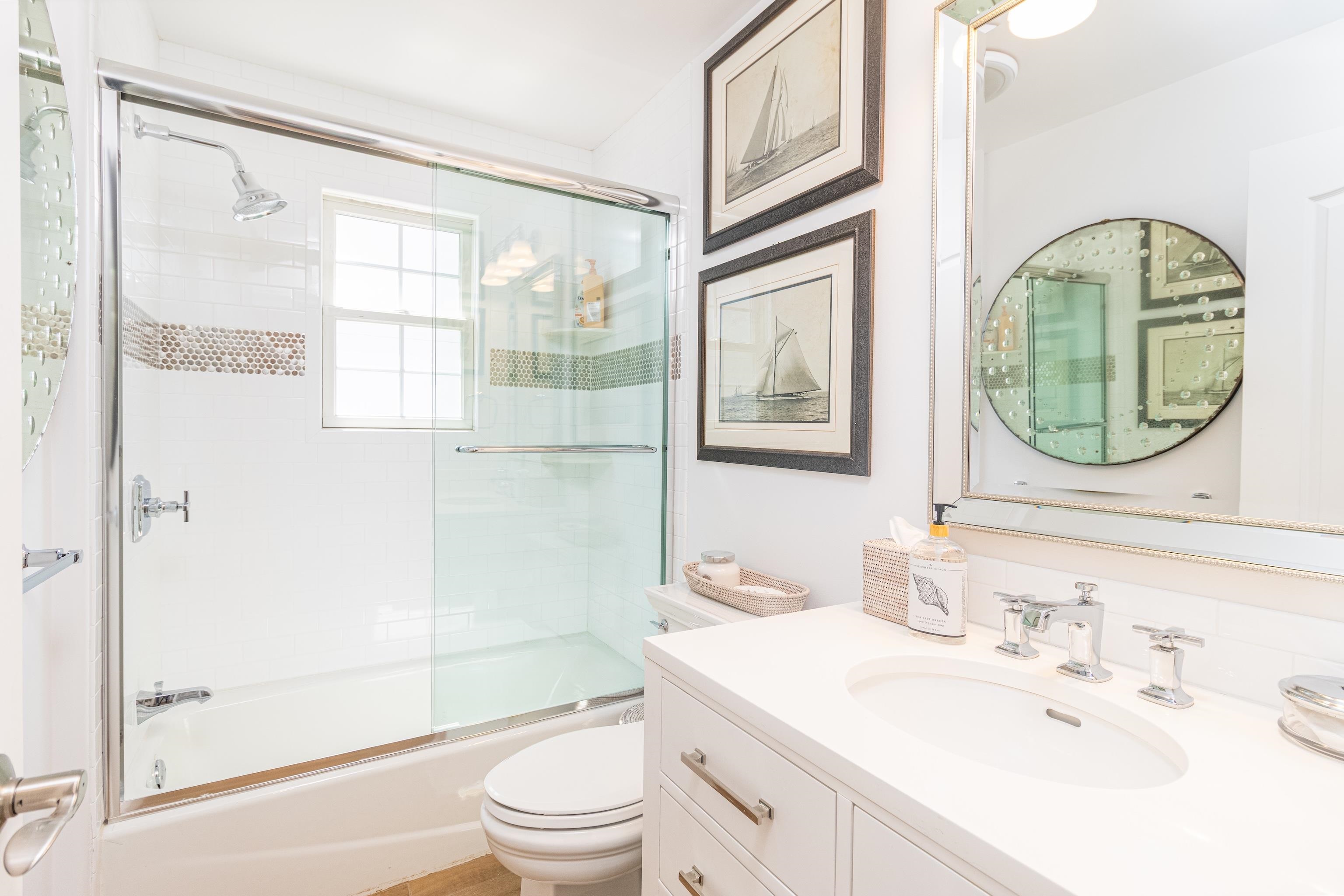 328 83rd Street Stone Harbor, NJ 08247 - Photo 22 of 34 a bathroom with a sink a toilet and shower
