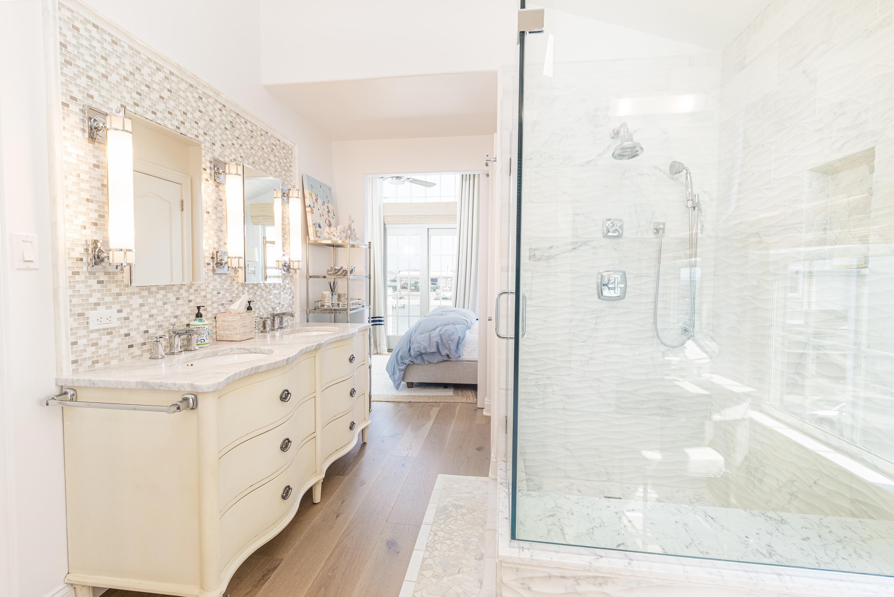 328 83rd Street Stone Harbor, NJ 08247 - Photo 25 of 34 a spacious bathroom with a shower sink and mirror