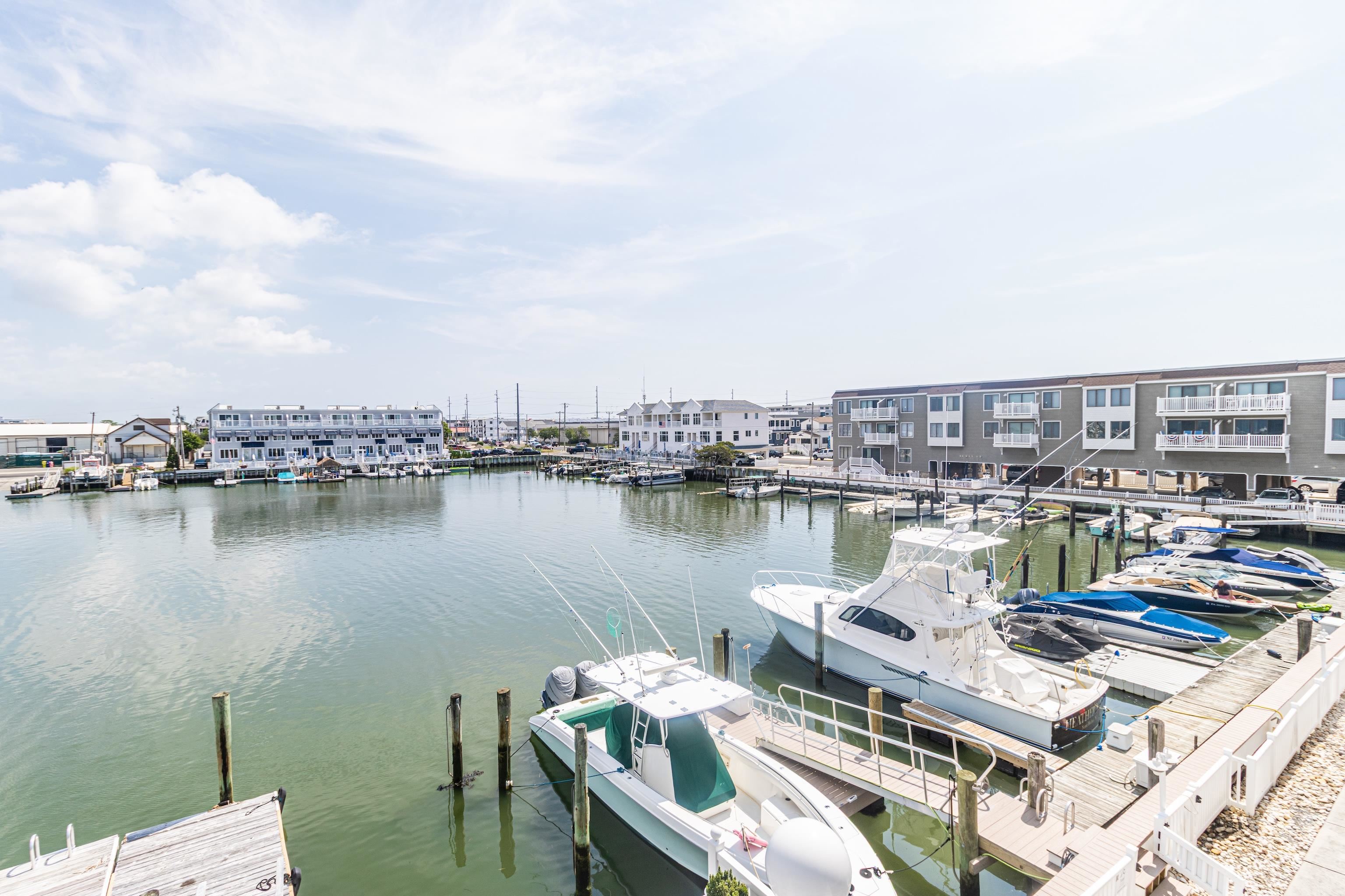328 83rd Street Stone Harbor, NJ 08247 - Photo 29 of 34 a view of a lake with a table and chairs