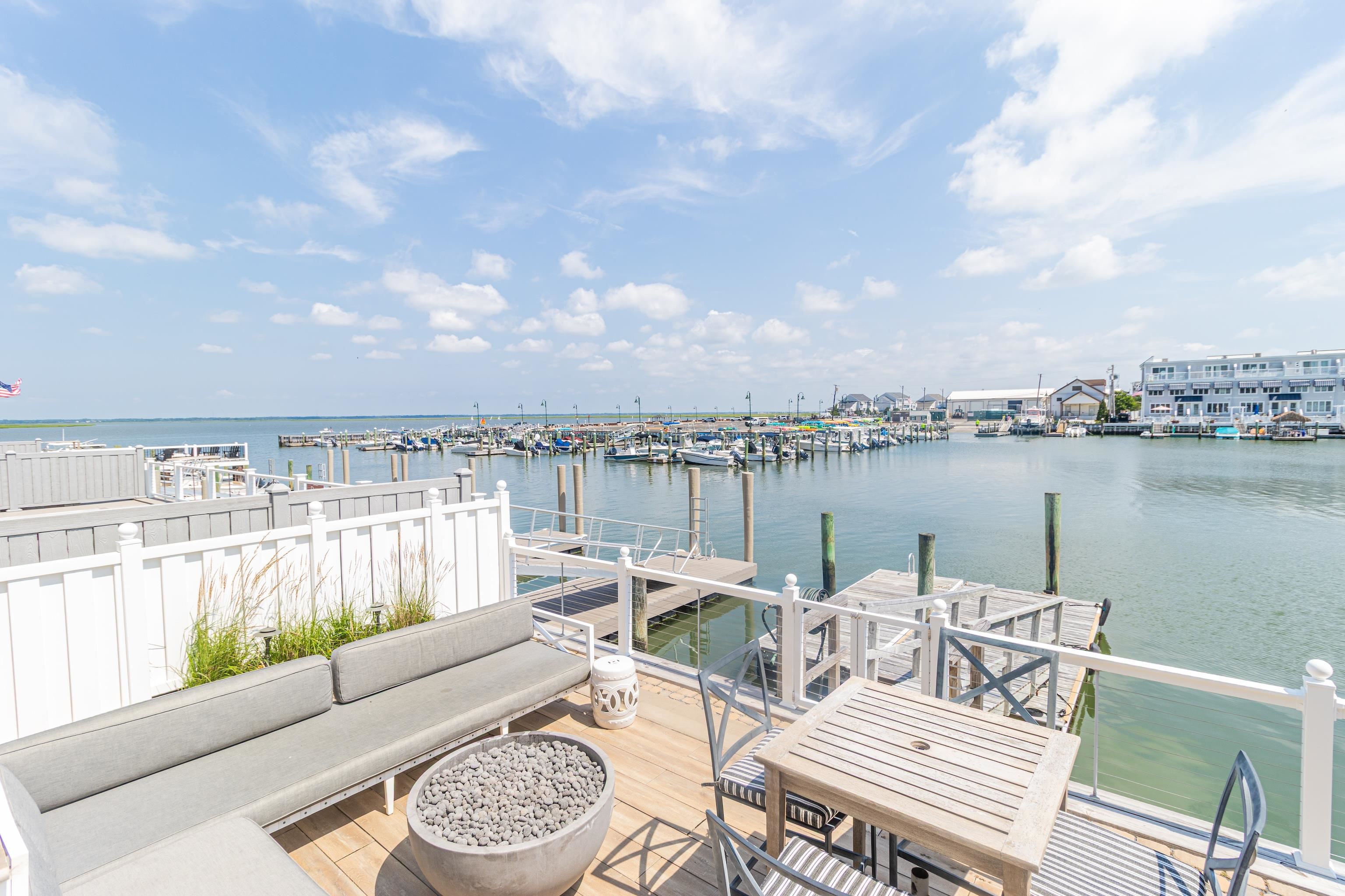 328 83rd Street Stone Harbor, NJ 08247 - Photo 30 of 34 a view of a lake with couches and city view