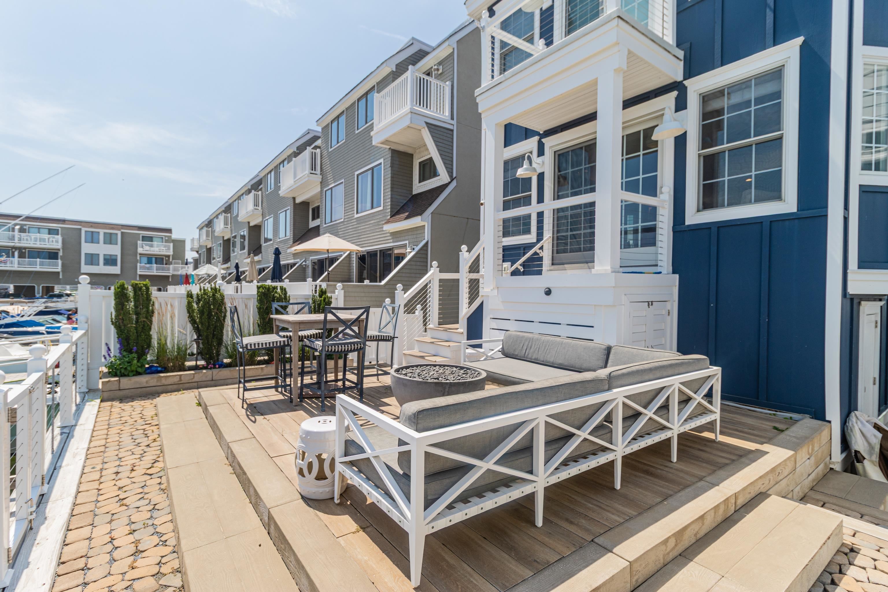 328 83rd Street Stone Harbor, NJ 08247 - Photo 34 of 34 a view of a patio with table and chairs