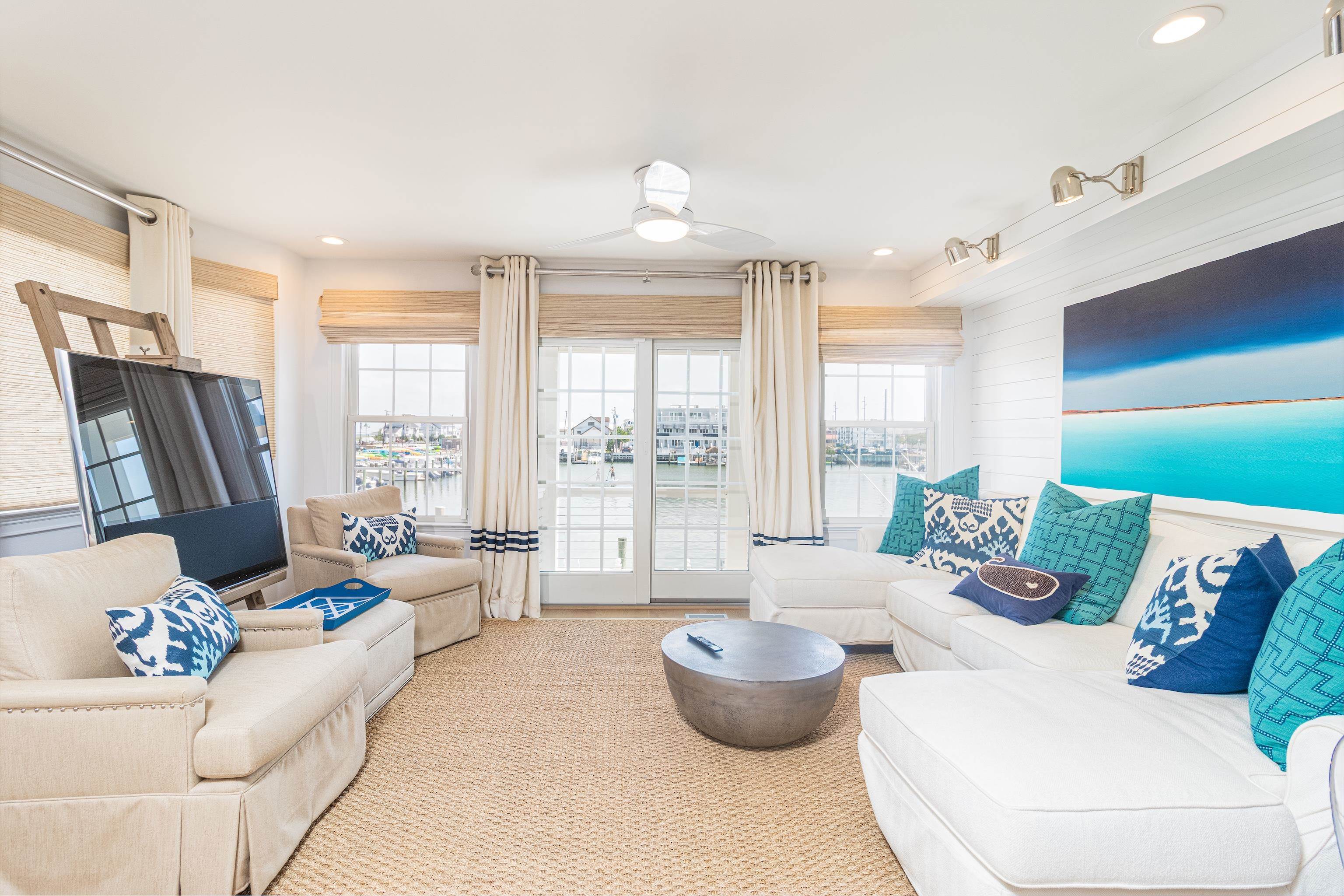 328 83rd Street Stone Harbor, NJ 08247 - Photo 10 of 34 a living room with furniture and a large window