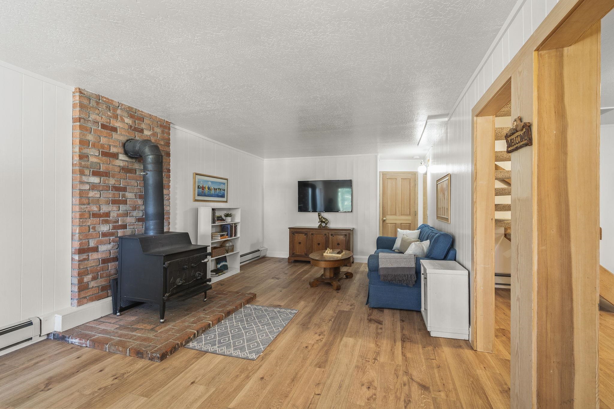 20 Observation Drive Tahoe City, CA 96145 - Photo 17 of 28 a living room with furniture large windows and wooden floor