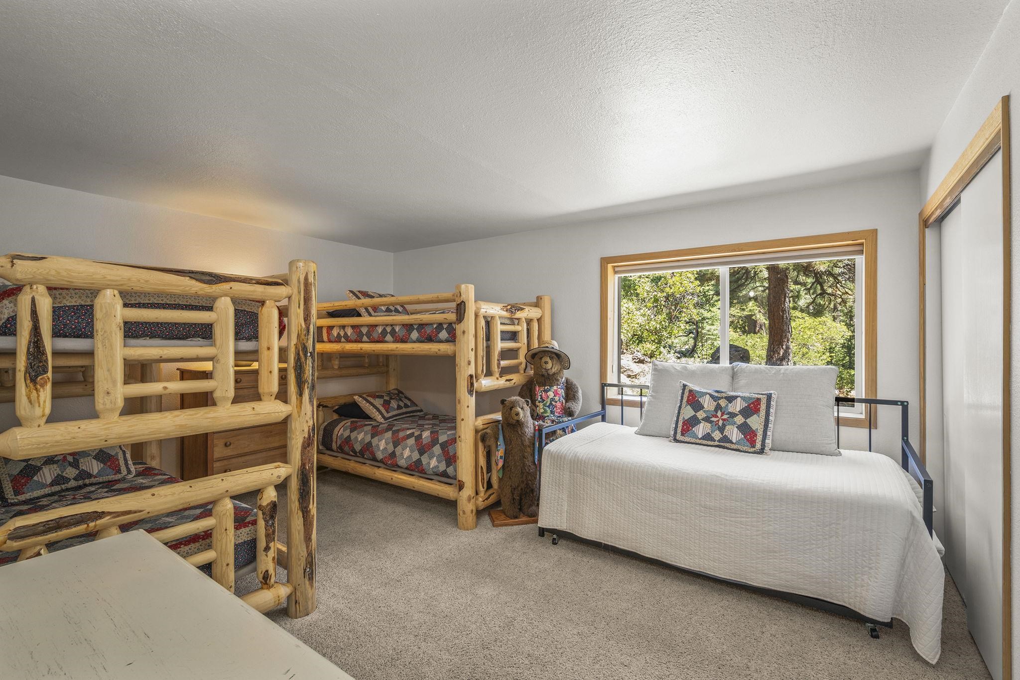 20 Observation Drive Tahoe City, CA 96145 - Photo 19 of 28 a bedroom with furniture and a large window