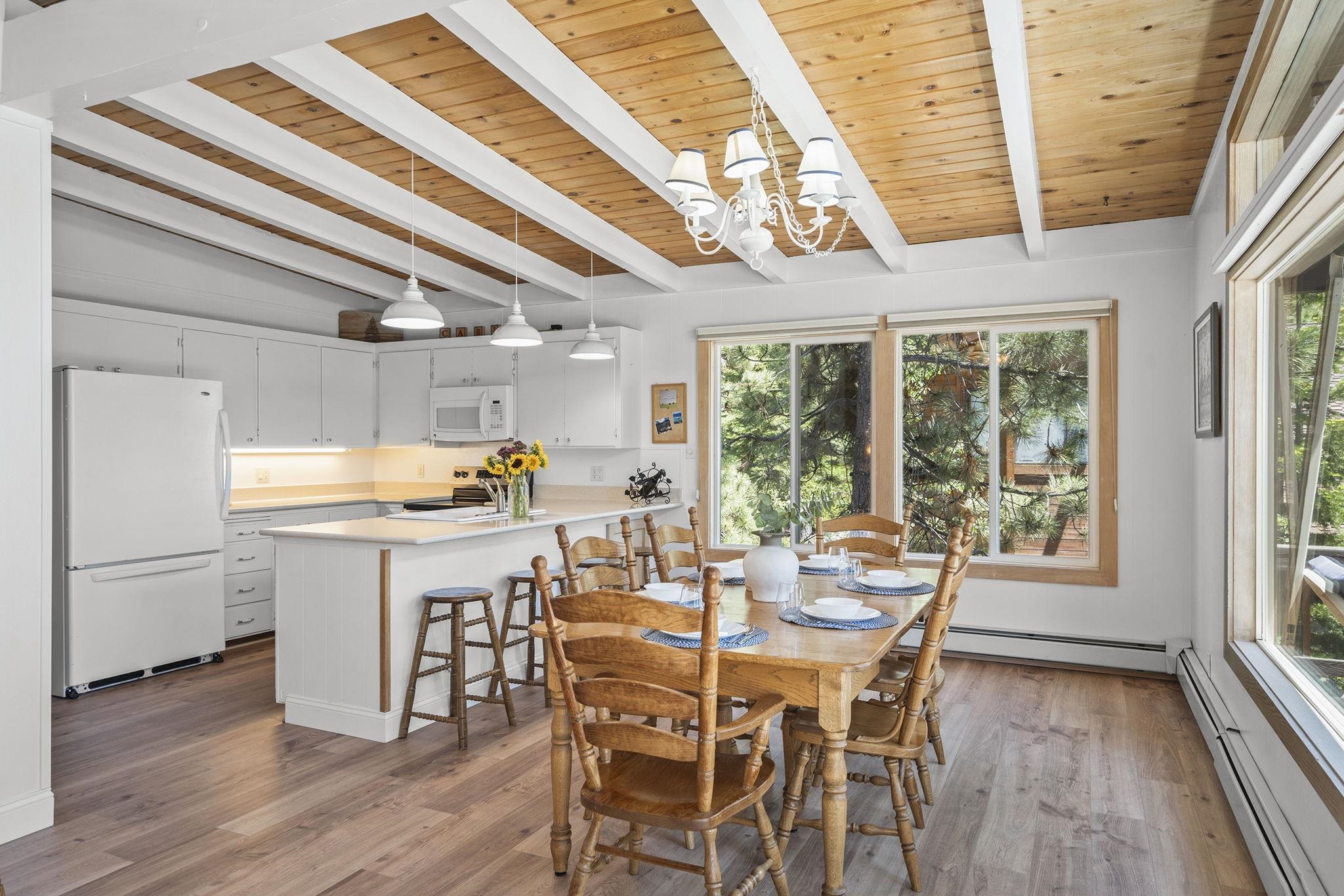 20 Observation Drive Tahoe City, CA 96145 - Photo 8 of 28 a dining room with furniture window wooden floor and stainless steel appliances