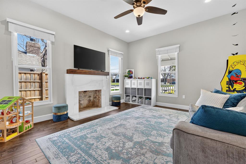 608 South Dooley Street Grapevine, TX 76051 - Photo 20 of 38 a living room with furniture and a fireplace