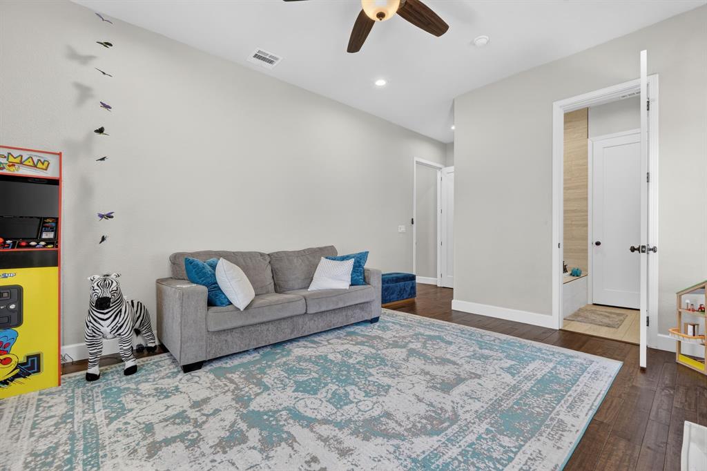 608 South Dooley Street Grapevine, TX 76051 - Photo 21 of 38 a living room with furniture and a flat screen tv