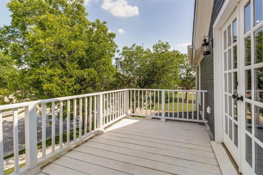 608 South Dooley Street Grapevine, TX 76051 - Photo 28 of 38 a balcony with trees in front of it