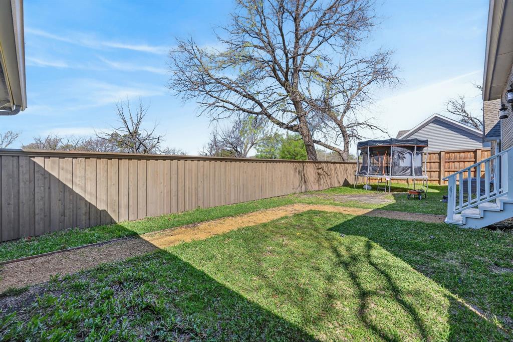 608 South Dooley Street Grapevine, TX 76051 - Photo 37 of 38 a view of a house with backyard and sitting area