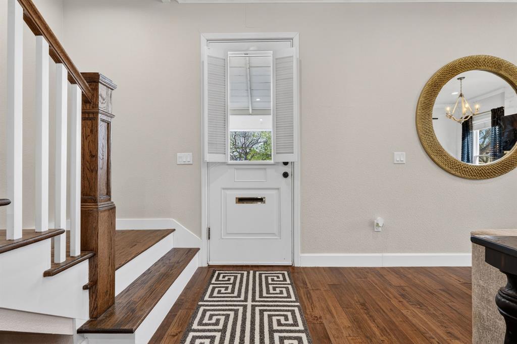 608 South Dooley Street Grapevine, TX 76051 - Photo 5 of 38 a view of a hallway with wooden floor and furniture