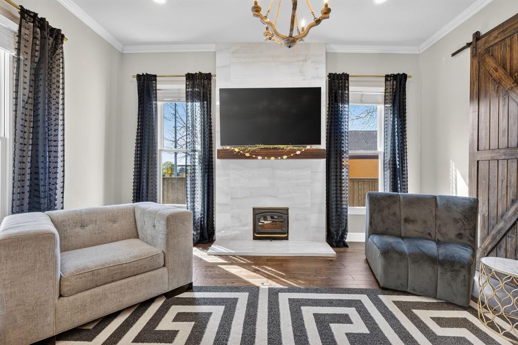 608 South Dooley Street Grapevine, TX 76051 - Photo 10 of 38 a living room with furniture flat screen tv and a fireplace