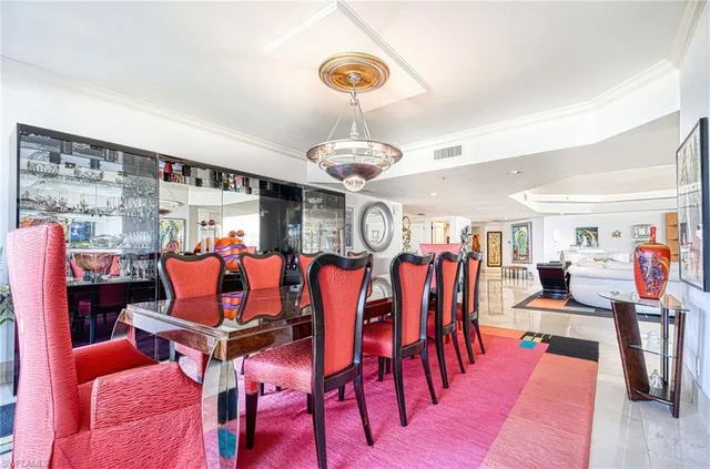 a very nice looking living room with dining room and wooden floor