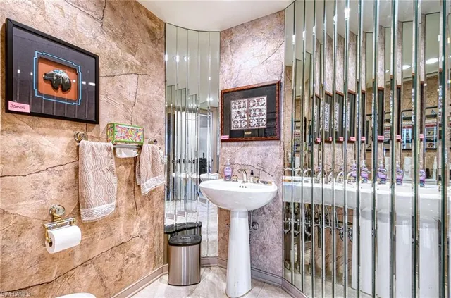 a bathroom with a sink and mirror