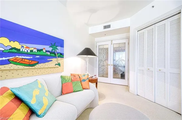 a living room with furniture and a gate