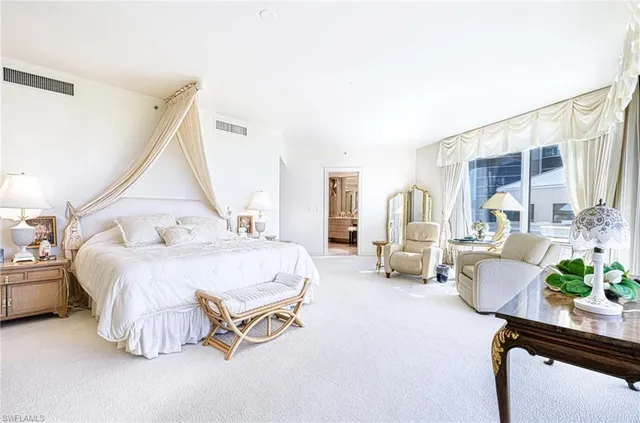 a bed room with a bed and a couch