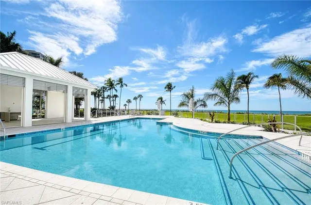 a view of swimming pool with lounge chair