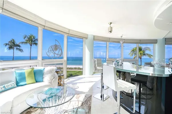 a kitchen with a table and chairs