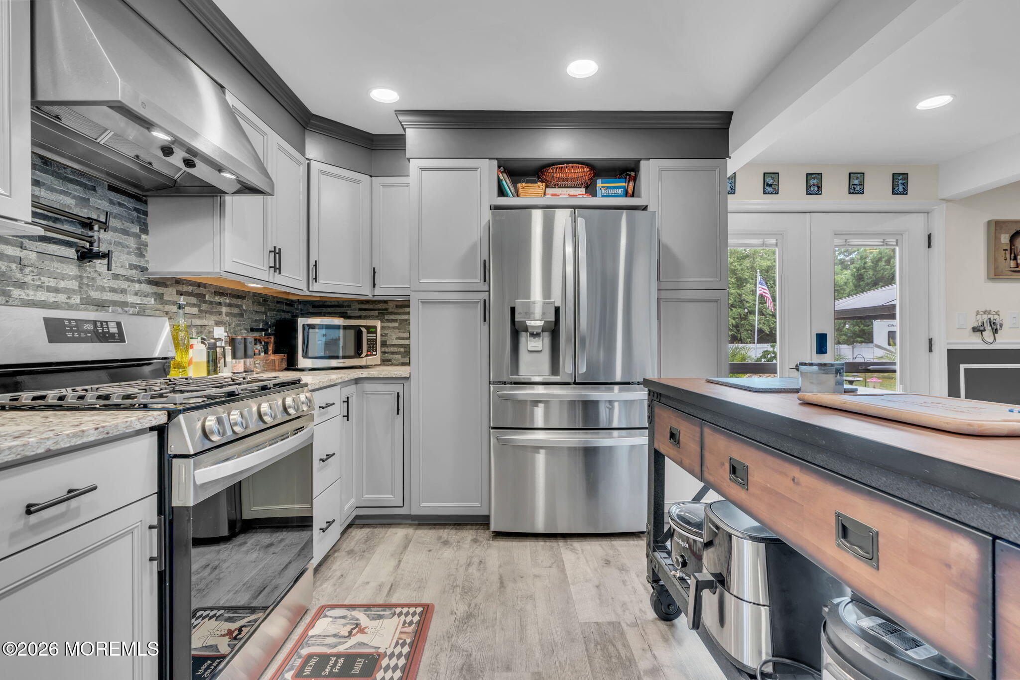 181 Locust Avenue Howell, NJ 07731 - Photo 26 of 66 a kitchen with stainless steel appliances granite countertop a refrigerator a stove and a sink