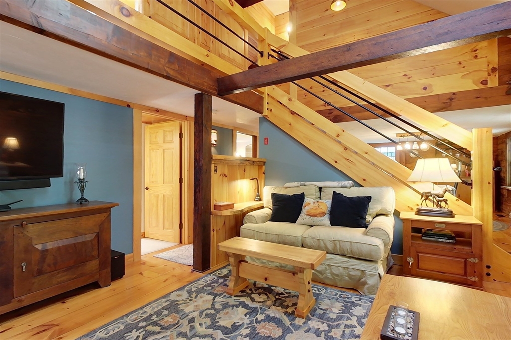 249 Pillsbury Road Ashby, MA 01431 - Photo 11 of 39 a living room with furniture and a flat screen tv