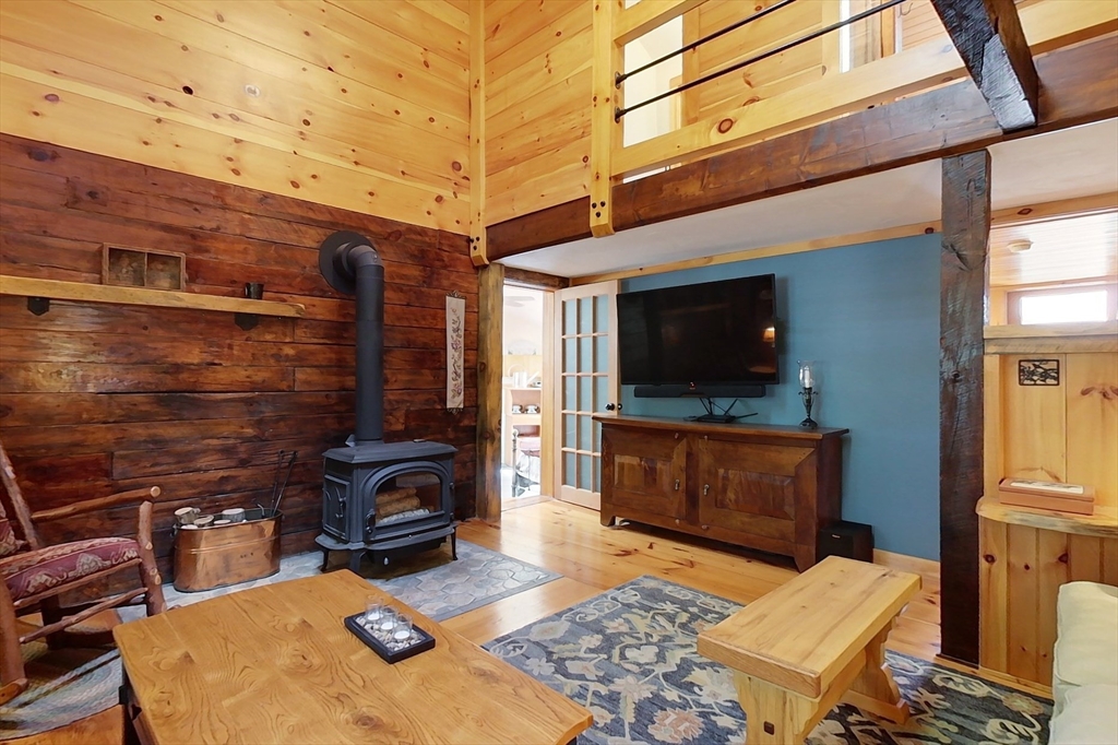 249 Pillsbury Road Ashby, MA 01431 - Photo 13 of 39 a living room with furniture and a flat screen tv