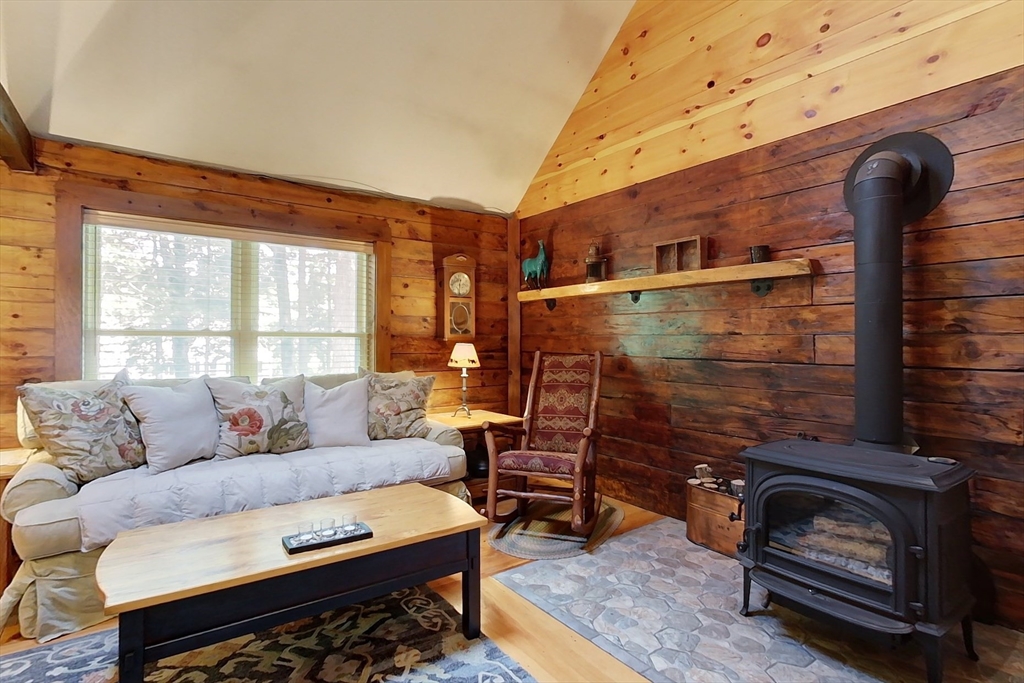 249 Pillsbury Road Ashby, MA 01431 - Photo 14 of 39 a living room with furniture and a fireplace