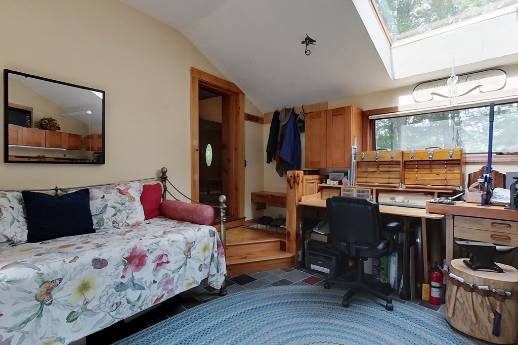 249 Pillsbury Road Ashby, MA 01431 - Photo 15 of 39 a bedroom with a bed and wooden floor