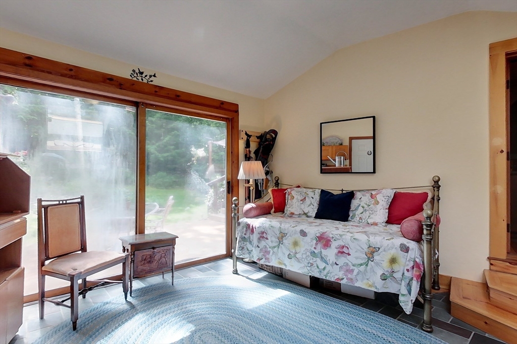 249 Pillsbury Road Ashby, MA 01431 - Photo 17 of 39 a bedroom with a bed and wooden floor