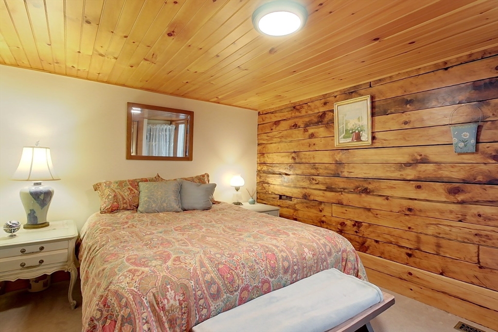 249 Pillsbury Road Ashby, MA 01431 - Photo 18 of 39 a bedroom with a bed and a night stand