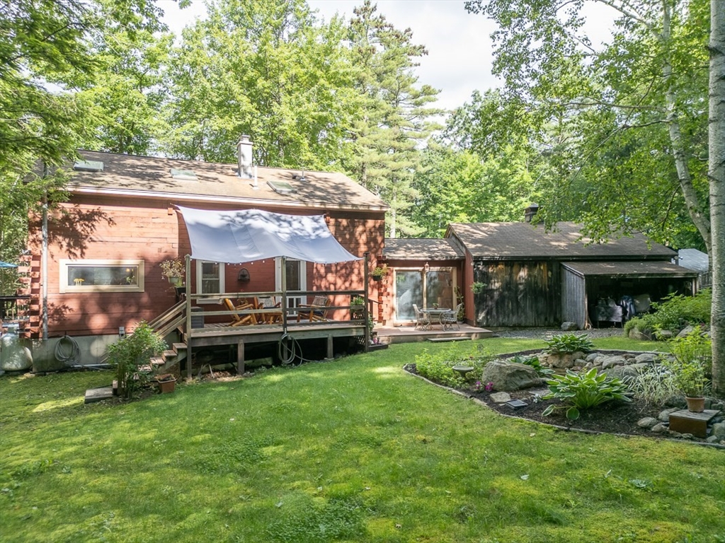 249 Pillsbury Road Ashby, MA 01431 - Photo 2 of 39 a house view with a sitting space and garden