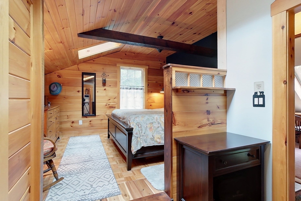 249 Pillsbury Road Ashby, MA 01431 - Photo 22 of 39 a bedroom with a bed and a table