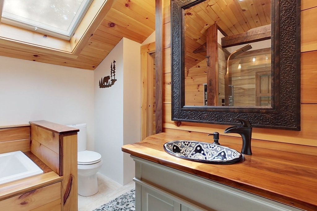 249 Pillsbury Road Ashby, MA 01431 - Photo 23 of 39 a bathroom with a sink a toilet and a mirror