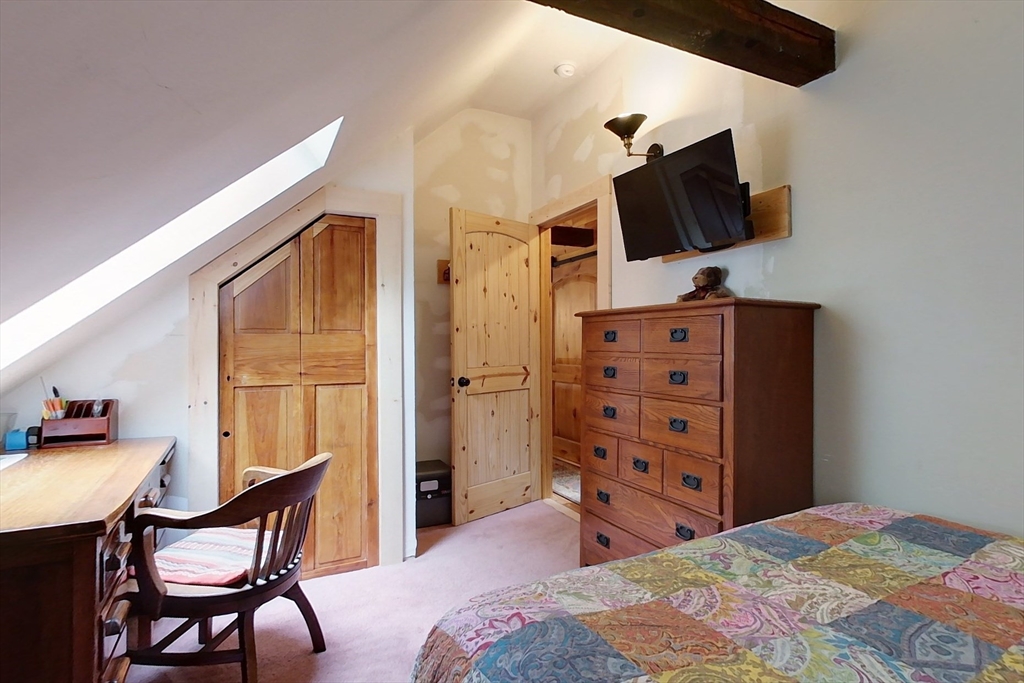 249 Pillsbury Road Ashby, MA 01431 - Photo 26 of 39 a bedroom with a bed and flat tv screen on the dresser