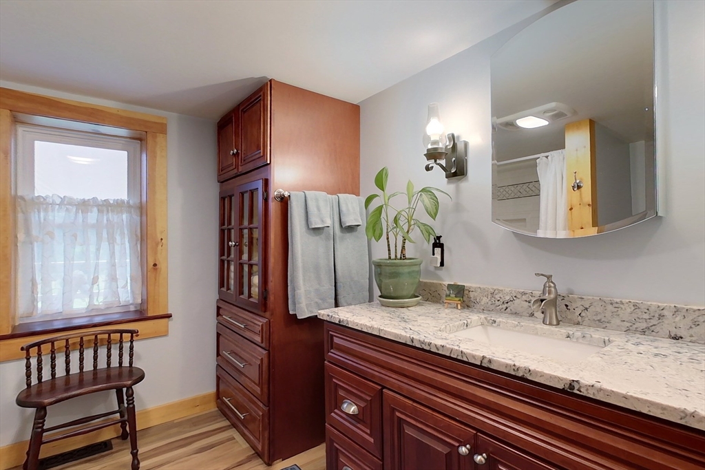 249 Pillsbury Road Ashby, MA 01431 - Photo 27 of 39 a bathroom with a granite countertop sink and a mirror