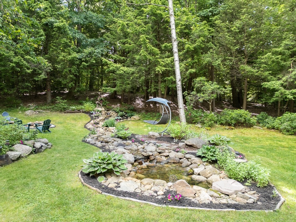 249 Pillsbury Road Ashby, MA 01431 - Photo 32 of 39 a garden with lots of trees and plants