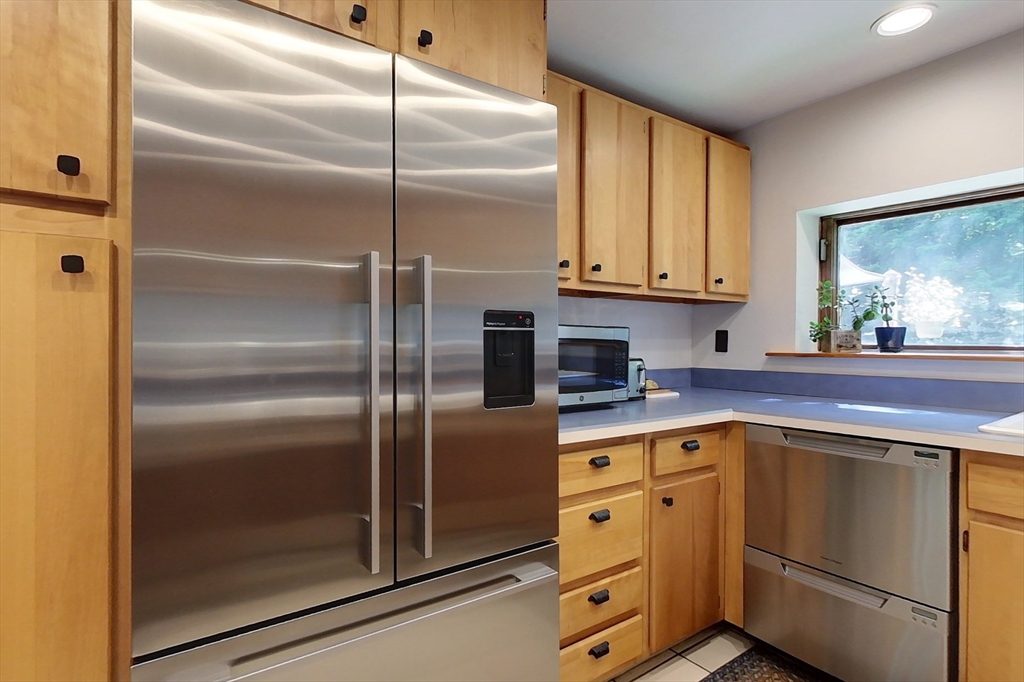 249 Pillsbury Road Ashby, MA 01431 - Photo 5 of 39 a kitchen with cabinets and stainless steel appliances